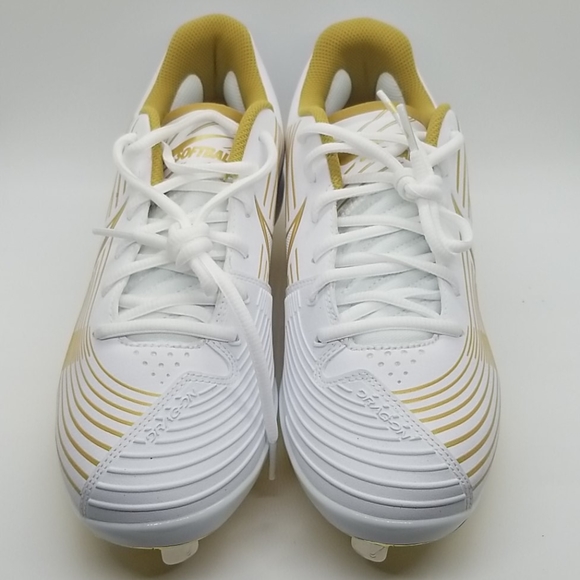 white cleats with gold bottom